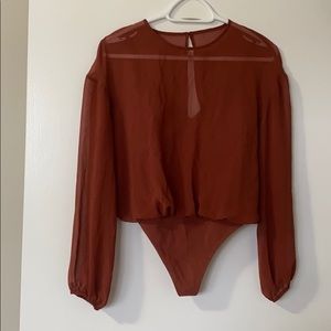 Bodysuit with sheer top overlay